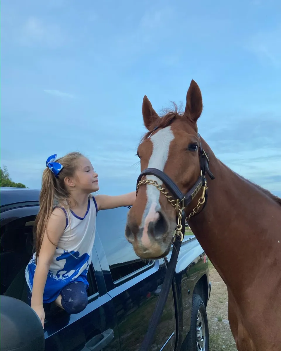 HG's daughter with one of the family's horses
